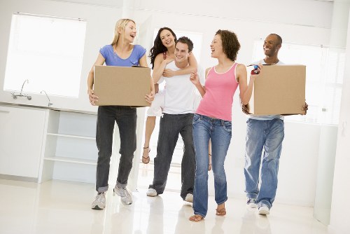 Professional movers handling household items in Chiswick
